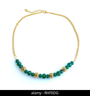 Handmade necklace from green beads and gold chain. Stock Photo