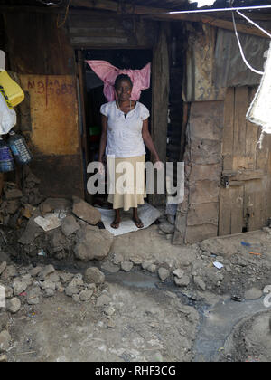 KENYA  -   photo by Sean Sprague  Visiting 'Annabel' who is HIV+, Mathare slum, Nairobi. Stock Photo