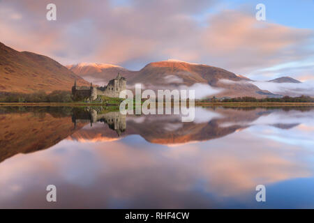 Kilchurn Castle captured at sunrise on a misty morning. Stock Photo