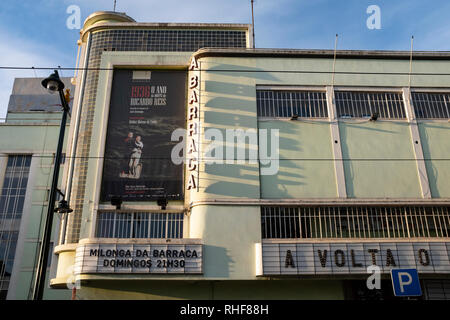 Art deco Abarraca cinema building with retro sign lit by strong sunlight casting shadows across the facade Stock Photo