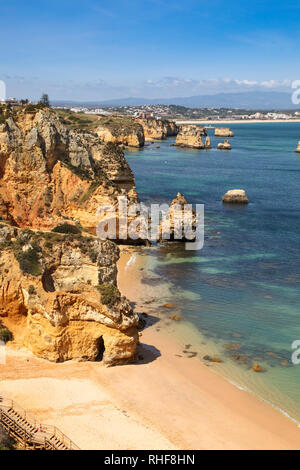 Lagos in Portugal is a popular tourist destination on the mediterranean with beaches such as MePraia do Camilo located amongst amazing cliff lines. Stock Photo