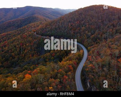 Aerial Drone view of Autumn / fall in the Blue ridge of the Appalachian Mountains near Asheville, North Carolina. Vibrant red, yellow, orange leaves. Stock Photo