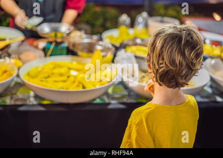 Boy tourist on Walking street Asian food market Stock Photo