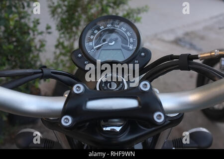 Motorcycle handlebar controls including speedometer Stock Photo