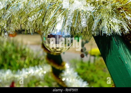 Christmas Australia TinselOutdoor Christmas decorations in  Australia including Tinsel and mirror ball bauble Stock Photo