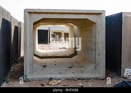 Concrete encasements for sewer pipes waiting to be used. Stock Photo