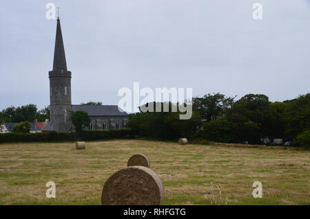 The church of St Philippe de Torteval has the Tallest Steeple and Oldest Bell on Guernsey, Channel Islands.UK. Stock Photo