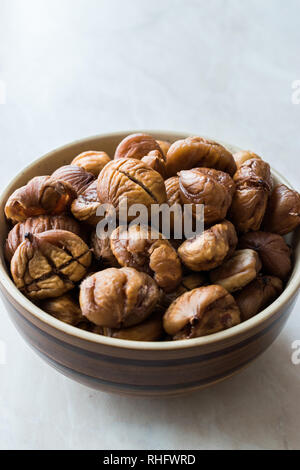 Peeled Roasted Raw Organic Chestnuts in Bowl. Organic Food. Stock Photo