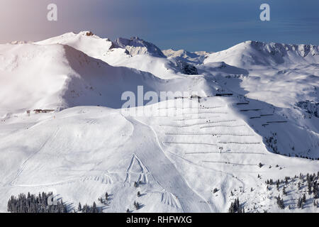 Winter mountains background with ski slopes and ski lifts. Skiing resort. Extreme sport. Active holiday. Free time concept Stock Photo