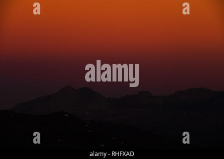 Fading moonlight from a Super Blood Red Moon over the El Torcal mountain range, Malaga, Andalucia, Spain Stock Photo