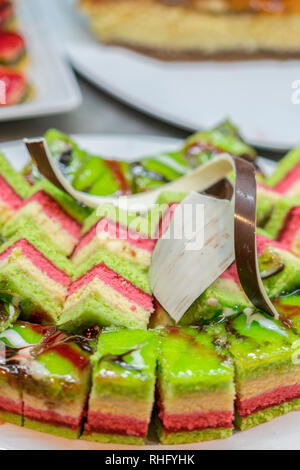 Closeup of tasty cake with jelly, chocolate chips and fruits. desserts in the restaurant. Dessert - Cake with Chocolate. close up. vertical photo Stock Photo