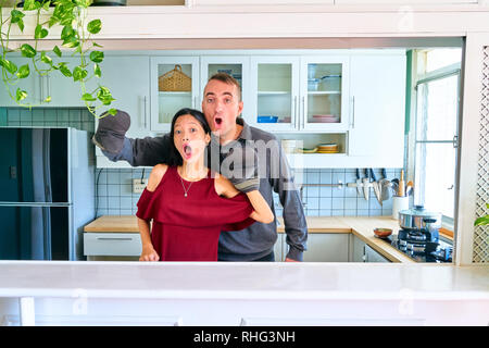 Lovely couple posing - making a face and playing the puppet hands Stock Photo