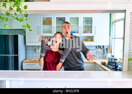 Lovely couple posing - playing the puppet hands and enjoying Stock Photo