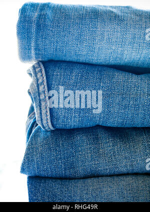 Pile of different blue jeans, fabric texture Stock Photo
