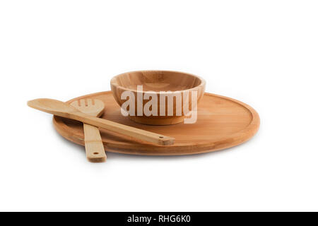 Wooden plate, bowl, spoon and fork isolated on white background bamboo top view Stock Photo