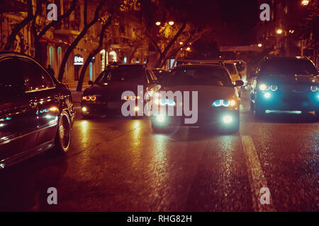 Night view of the cars. Road in the city at the night with yellow and red electrical light for cars during they are coming home. The cars compete at Stock Photo