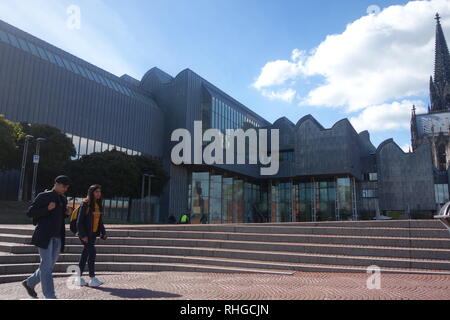 Two people walk past the Museum Ludwig modern art gallery in Cologne, Germany Stock Photo