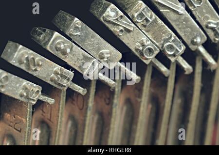Close up of vintage, dirty typewriter letteters with copy space. Conceptual image of old fashioned office work, communication or writing. Stock Photo