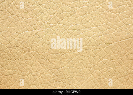 Leatherette background in warm light brown tone. Stock Photo