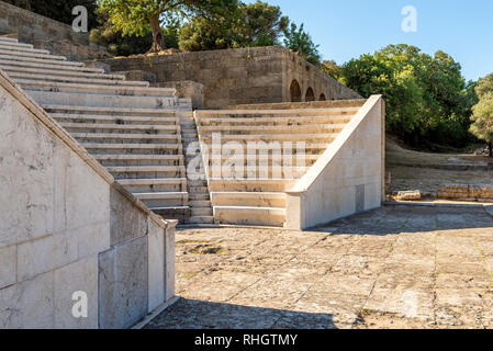 Ancient theater with marble seats and stairs. The Acropolis of Rhodes. Rhodes island, Greece Stock Photo