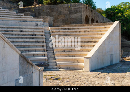 Ancient theater with marble seats and stairs.The Acropolis of Rhodes. Rhodes island, Greece Stock Photo