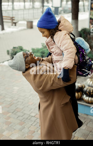 Loving father feeling amazing meeting his girl after kindergarten Stock Photo