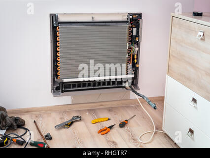 Installation new air conditioner. Stock Photo