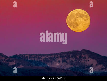 Super moon rising over the Eagle Cap Wilderness, Union County, Oregon Stock Photo
