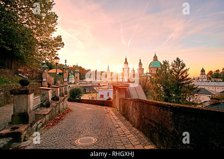 Beautiful sunset view of Salzburg Cathedral (Dom zu Salzburg) at Residenzplatz square in summer in Salzburg, Salzburger Land, Austria. Stock Photo