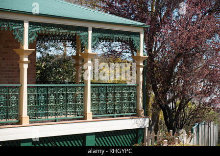 Iron lacework and a corrugated steel roof of a Federation filigree style home in Millthorpe, New South Wales, Australia Stock Photo