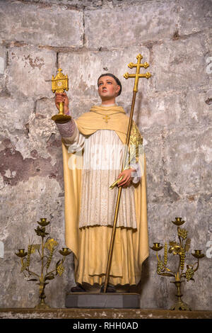 Statue of St Norbert de Xanten in the abbey church of St Foy in Conques France.  The abbey has been an important stop for pilgrims on the Santiago de  Stock Photo