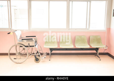 hospital waiting room with wheelchair and  chairs. Stock Photo