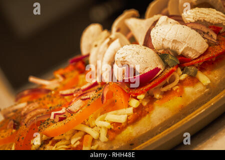 Fresh Half and Half Pizza Ready for the Oven Stock Photo