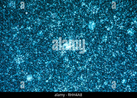 Blue Sponge Foam Texture Macro Background. Abstract background of a thin layer of foam rubber. Translucent material. Fibers Stock Photo