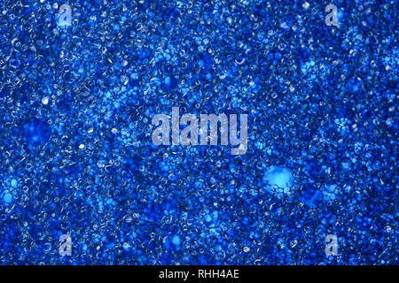 Blue Sponge Foam Texture Macro Background. Abstract background of a thin layer of foam rubber. Translucent material. Fibers Stock Photo