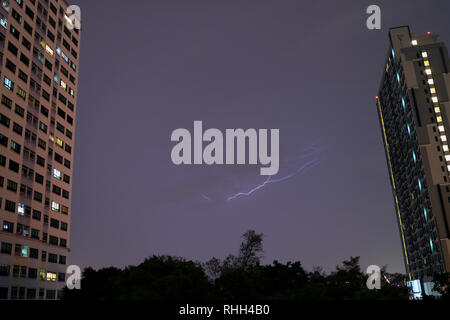 Real lightning flashing on the evening sky of Bangkok, Thailand Stock Photo