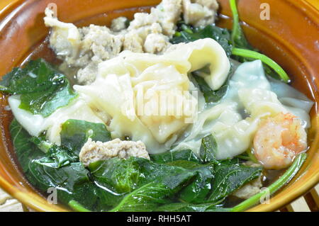 boiled shrimp dumpling with spinach and minced pork in hot soup Stock Photo