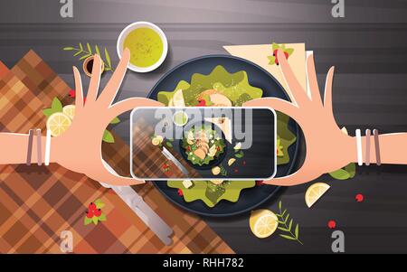 food blogger taking mobile photo of fresh vegetable salad with chicken and sauce in black bowl top angle view smartphone screen social network Stock Vector