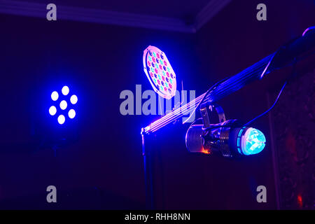 Stage lights in action at the concert. Lights show. Lazer show. Night club dj party people enjoy of music dancing sound with colorful light. club nigh Stock Photo