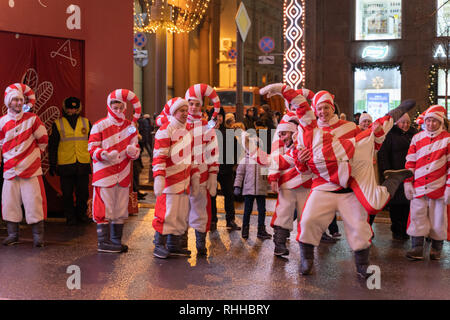 Moscow, Russia - January 2019: Actors dressed like fairy tale elves engaged in a dance battle on the streets of central Moscow during winter holiday s Stock Photo