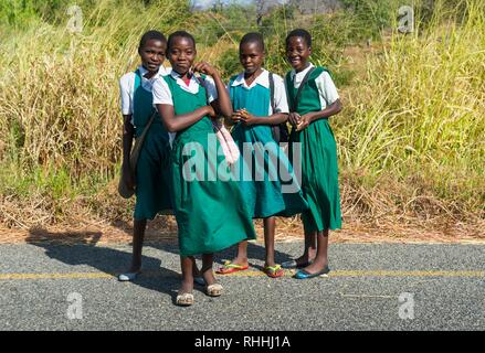 Young school girls on their way home, Cape Maclear, Malawi, Africa Stock Photo