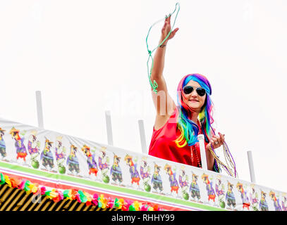 Dauphin Island, Alabama, USA. 2nd Feb, 2019. A woman in costume throws Mardi Gras beads at the Krewe de la Dauphine Mardi Gras parade, Feb. 2, 2019, in Dauphin Island, Alabama. The Dauphin Island parade kicks off the official Mardi Gras parade season in Mobile, Alabama. Mobile’s first official Mardi Gras celebration was recorded in 1703.(Photo by Carmen K. Sisson/Cloudybright) Credit: Carmen K. Sisson/Cloudybright/Alamy Live News Stock Photo