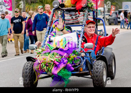Dauphin Island, Alabama, USA. 2nd Feb, 2019. Two men ride in a decorated Trailmaster XRX 150 go-kart during the Krewe de la Dauphine Mardi Gras parade, Feb. 2, 2019, in Dauphin Island, Alabama. The Dauphin Island parade kicks off the official Mardi Gras parade season in Mobile, Alabama. Mobile’s first official Mardi Gras celebration was recorded in 1703.  (Photo by Carmen K. Sisson/Cloudybright) Credit: Carmen K. Sisson/Cloudybright/Alamy Live News Stock Photo