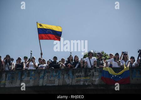 Caracas, Venezuela. 2nd Feb 2019. A man is seen waving the venezuelan flag during a protest against Maduro. Opposition supporters take part in a rally against Venezuelan President Nicolas Maduro's government in Caracas and to support Venezuelan opposition leader and self-proclaimed interim president Juan Guaido. Credit: SOPA Images Limited/Alamy Live News