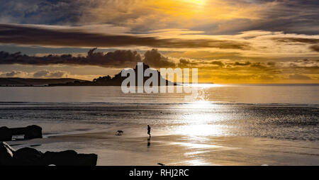 Longrock, Cornwall, UK. 3rd Feb 2019. UK Weather. It was 4 degrees C on a sunny start to the day in the south west of Cornwall. There were people out fishing, jogging and walking their dogs on the beach. Credit: Simon Maycock/Alamy Live News Stock Photo