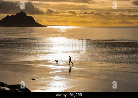 Longrock, Cornwall, UK. 3rd Feb 2019. UK Weather. It was 4 degrees C on a sunny start to the day in the south west of Cornwall. There were people out fishing, jogging and walking their dogs on the beach. Credit: Simon Maycock/Alamy Live News Stock Photo