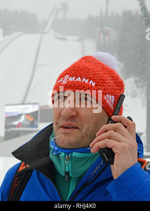 Klingenthal, Germany. 03rd Feb, 2019. Nordic Combined, World Cup, Single, Large Hill, 10 km. Andreas Langer, head of the competition, stands with his radio in front of the hill. Credit: Hendrik Schmidt/dpa-Zentralbild/dpa/Alamy Live News Stock Photo