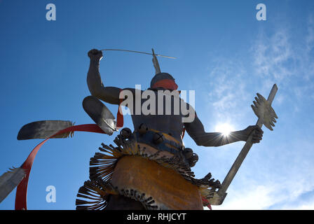 A bronze sculpture titled 'Apache Mountain Spirit Dancer' by Craig Dan Goseyun at the Museum of Indian Arts & Culture in Santa Fe, New Mexico Stock Photo