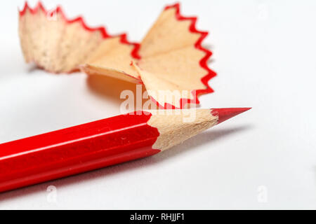 Red sharpened pencil close-up on a white background Stock Photo