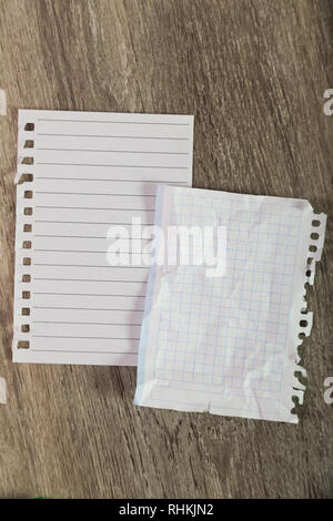 Torn sheets in notebook on table Stock Photo